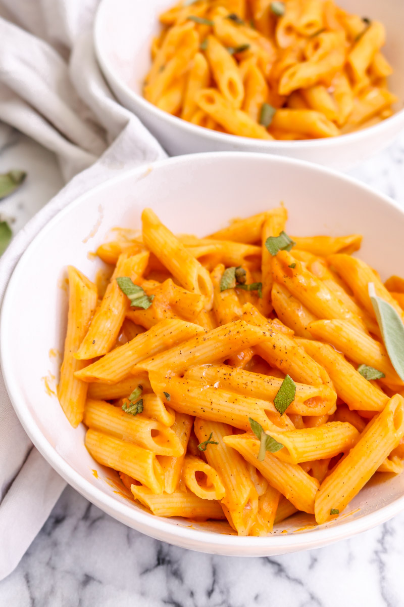 overhead image of pasta in a white bowl.