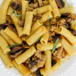 overhead image of pasta with pumpkin and turkey