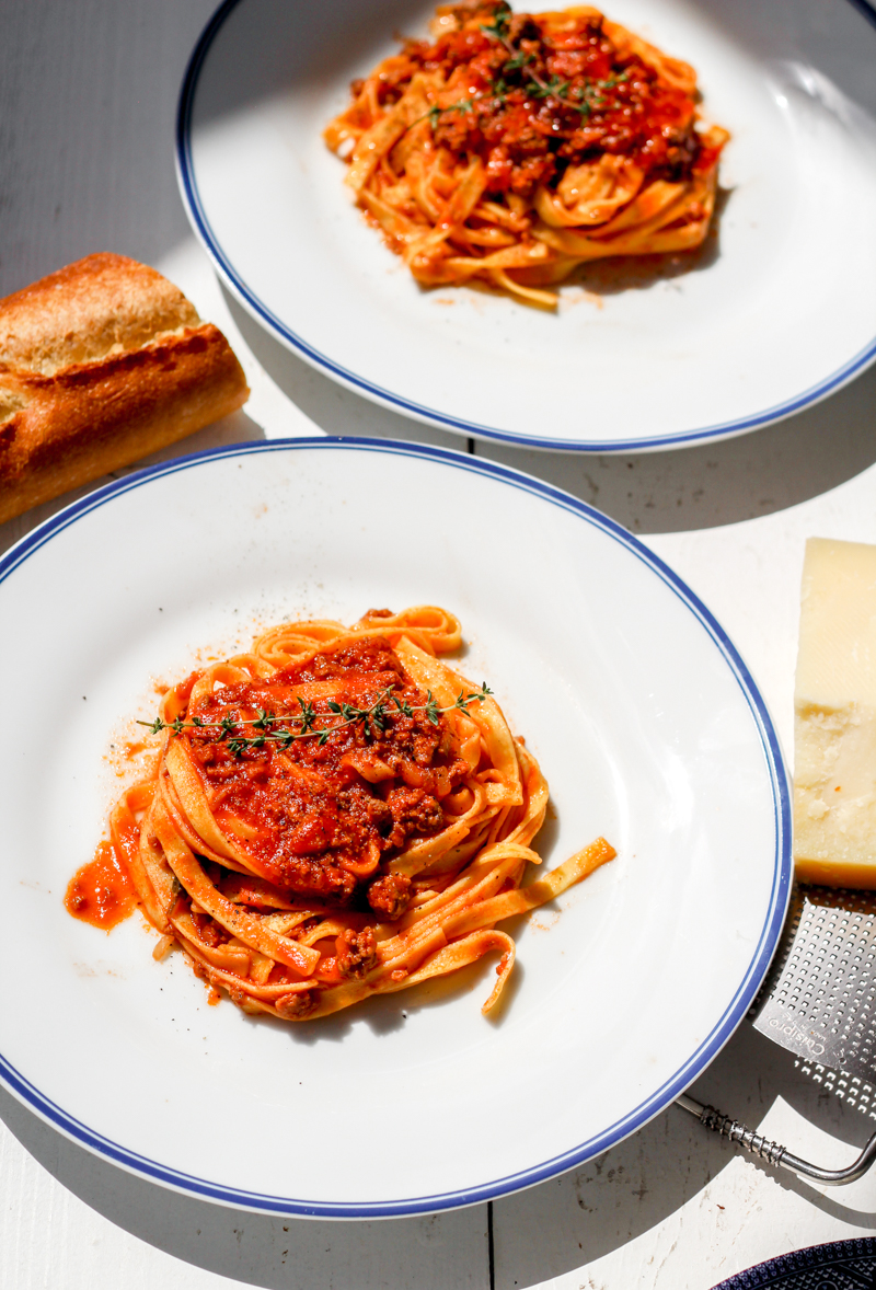 overhead image of fettuccine with weeknight lamb ragu' on a white plate