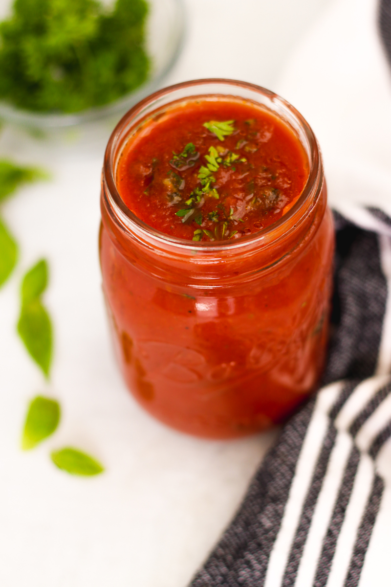 overhead image of a tomato sauce in a jar.