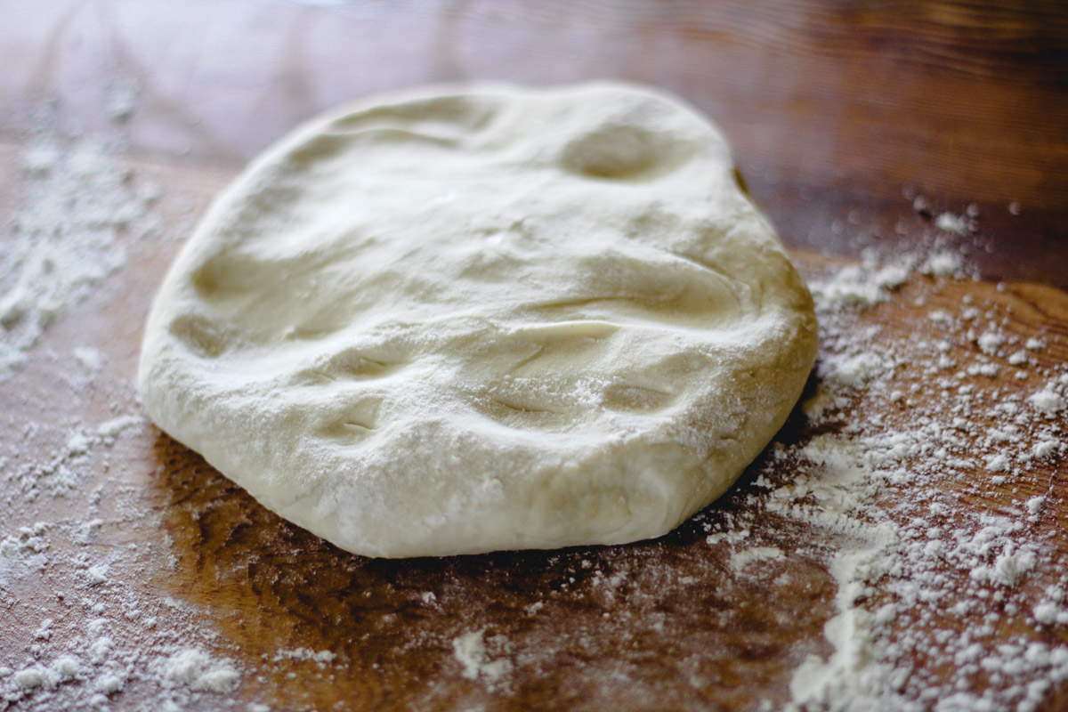 image of dough on a wooden board