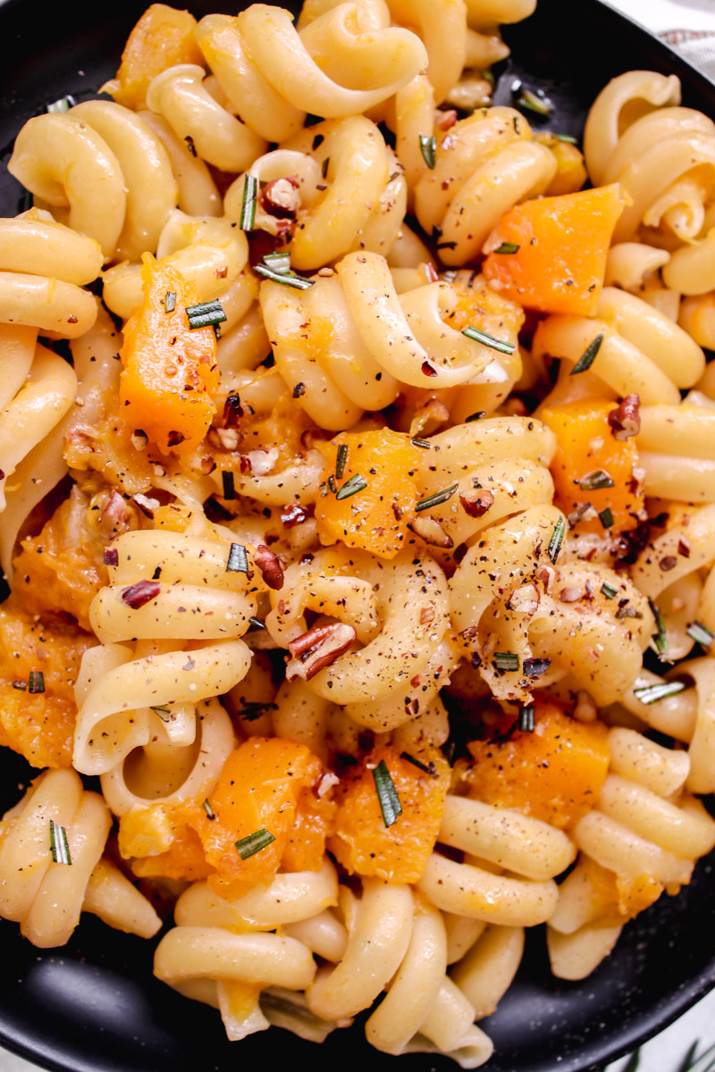 overhead image of pasta with vegetables on a plate