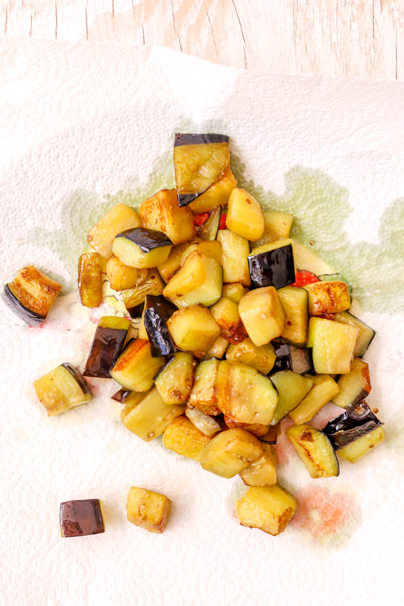 close-up image of eggplant chunks on a paper towel.