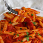 penne on a fork arabbiata sauce