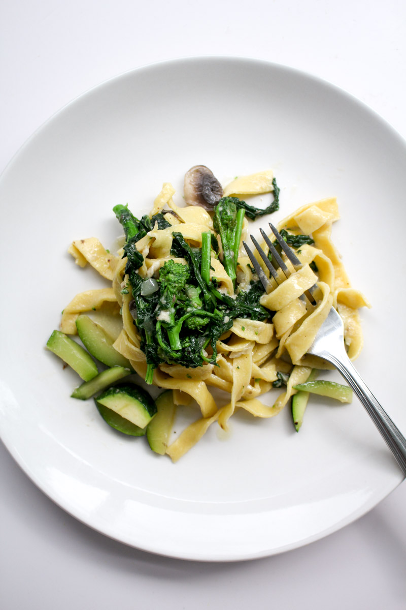 Mushroom Zucchini pasta on a white plate.