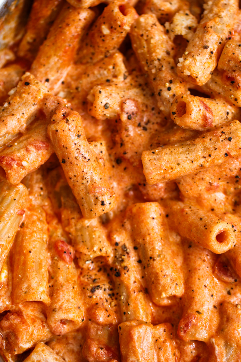close up image of pasta with ricotta tomato sauce. 