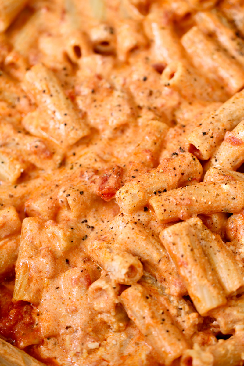 close up image of pasta with tomato ricotta sauce. 