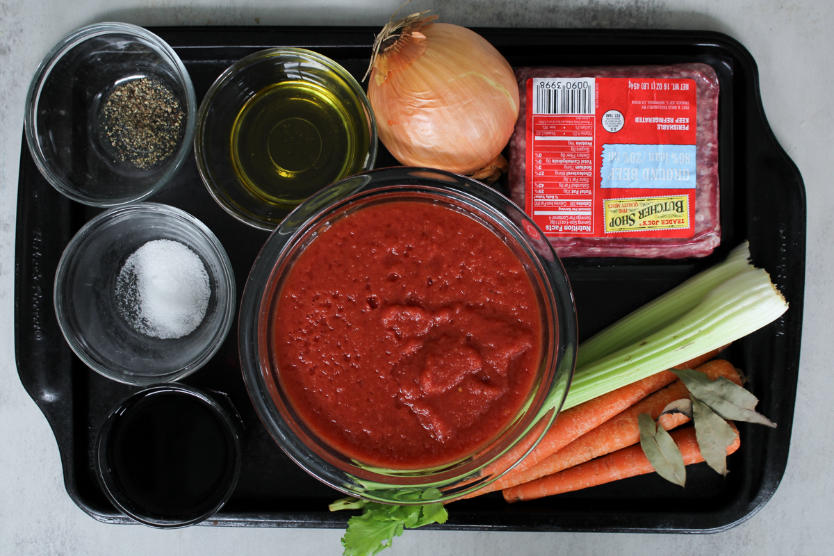 overhead image of ingredients on a baking tray in glass bowls. 